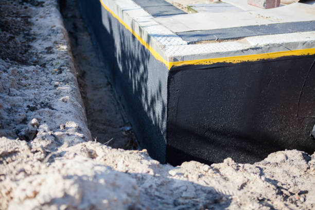 Professional Basement Waterproofing technician working in Brookwood, AL